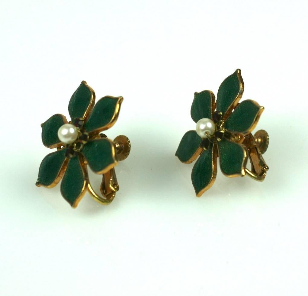 Miriam Haskell  Holiday Holly Earclips of signature Russian gilt,  ruby crystals and  focal center faux  pearl, with hard enameled  holly green leaves . Excellent condition.