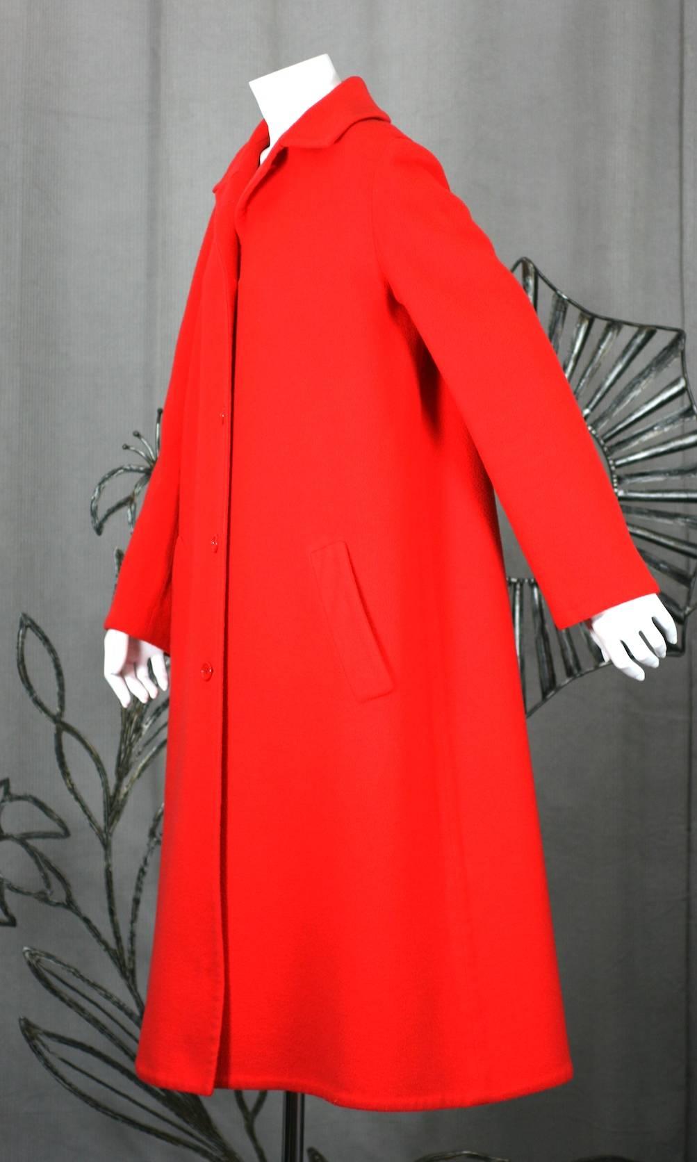 Halston's Double Faced Tomato Red Wool Coat, beautifully cut with simple, slightly flared shape. 5 button front closure with shirt collar and slash pockets. 
Double faced fabrics were among Halston's favorites. They were light, modern, packable and