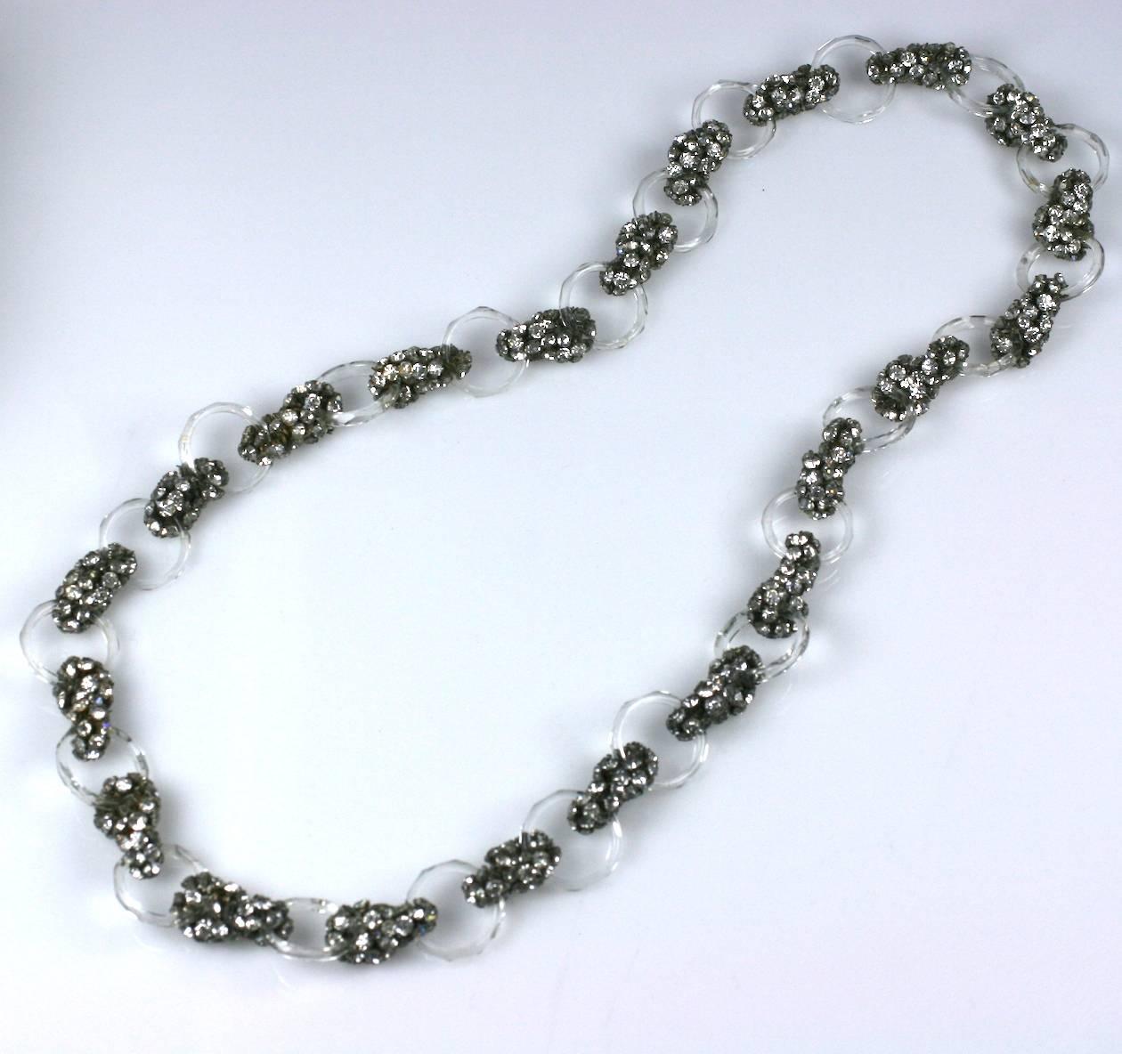 Art Deco Maison Gripoix faceted crystal ring and diamante cluster long flapper style sautoir. Hundreds of hand sewn pastes are used as connectors between the rings. 
This substantial necklace is imitative of the rage for rock crystal and diamond