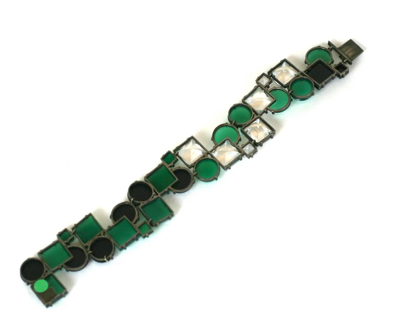 Important Art Deco Cubist Bracelet. 6 panels of articulated links forming a series of stone "tiles" in square, round and pac man shaped stones, cut from crysophrase (green onyx), onyx and rock crystal and all hand set in sterling