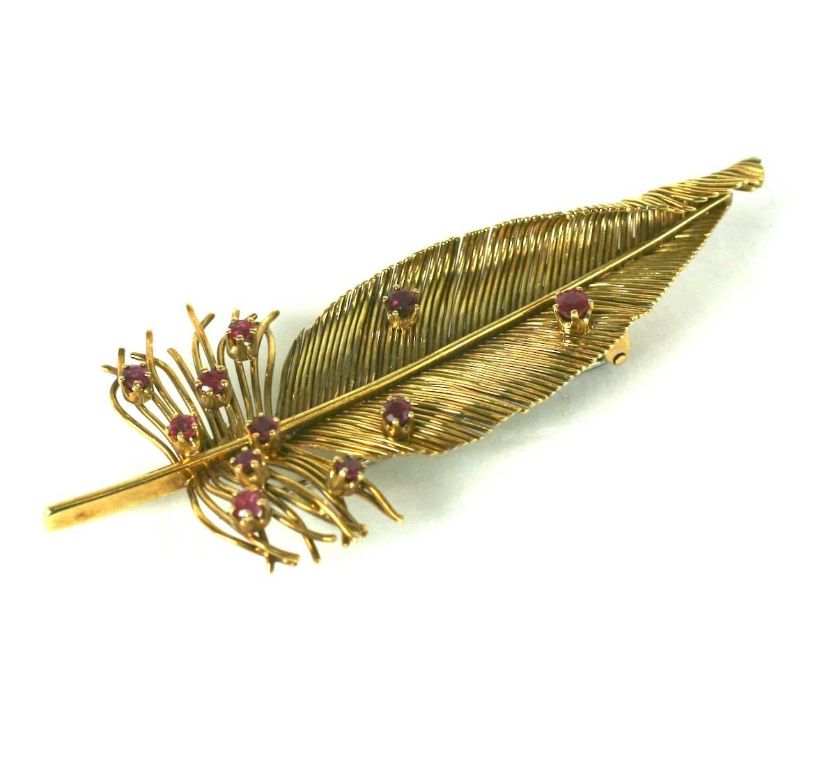 Elegant 18k Gold and Ruby Feather Brooch by Sanz, Spain. Lovely handmade brooch with dozens of delicate wires forming body of feather further accented with 11 prong set rubies. Lovely naturalistic furled design. 2.75