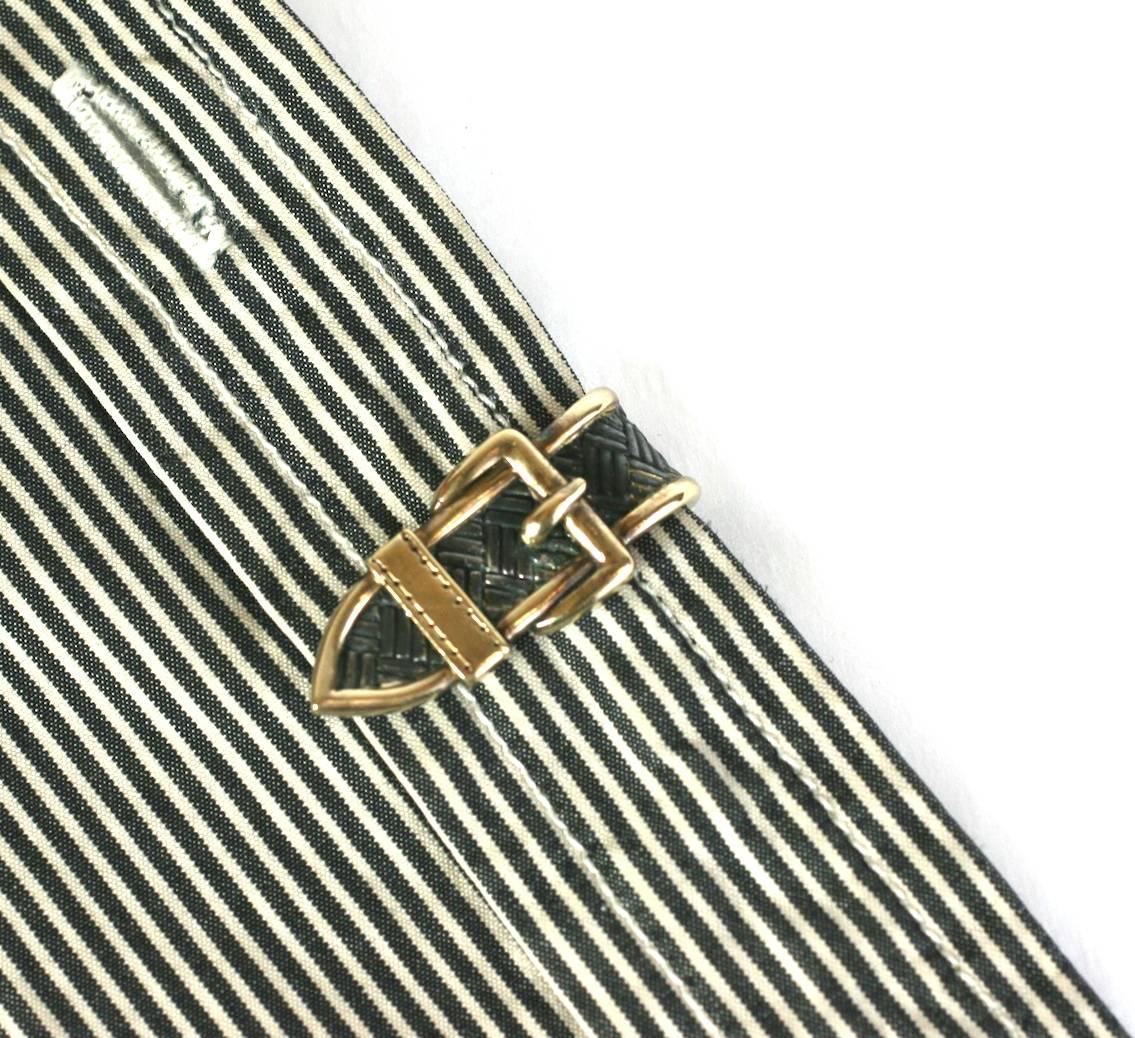 Elegant Buckle Clip suitable for men or women in sterling with 14k gold accents. Beautifully hand crafted in the quality of period Hermes, this small clip can be used to hold down a scarf or purely as a decorative element on a pocket, lapel or