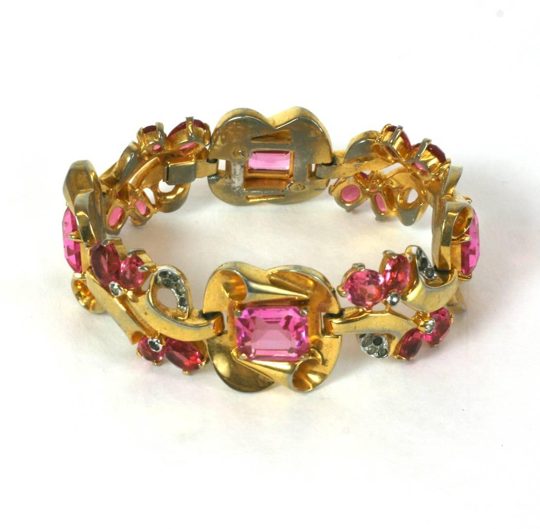 Mazer Brothers Retro style faux pink tourmaline link bracelet of gold plated metal and crystal  pave.  Excellent Condition. 1940's USA. 
Length 7.75