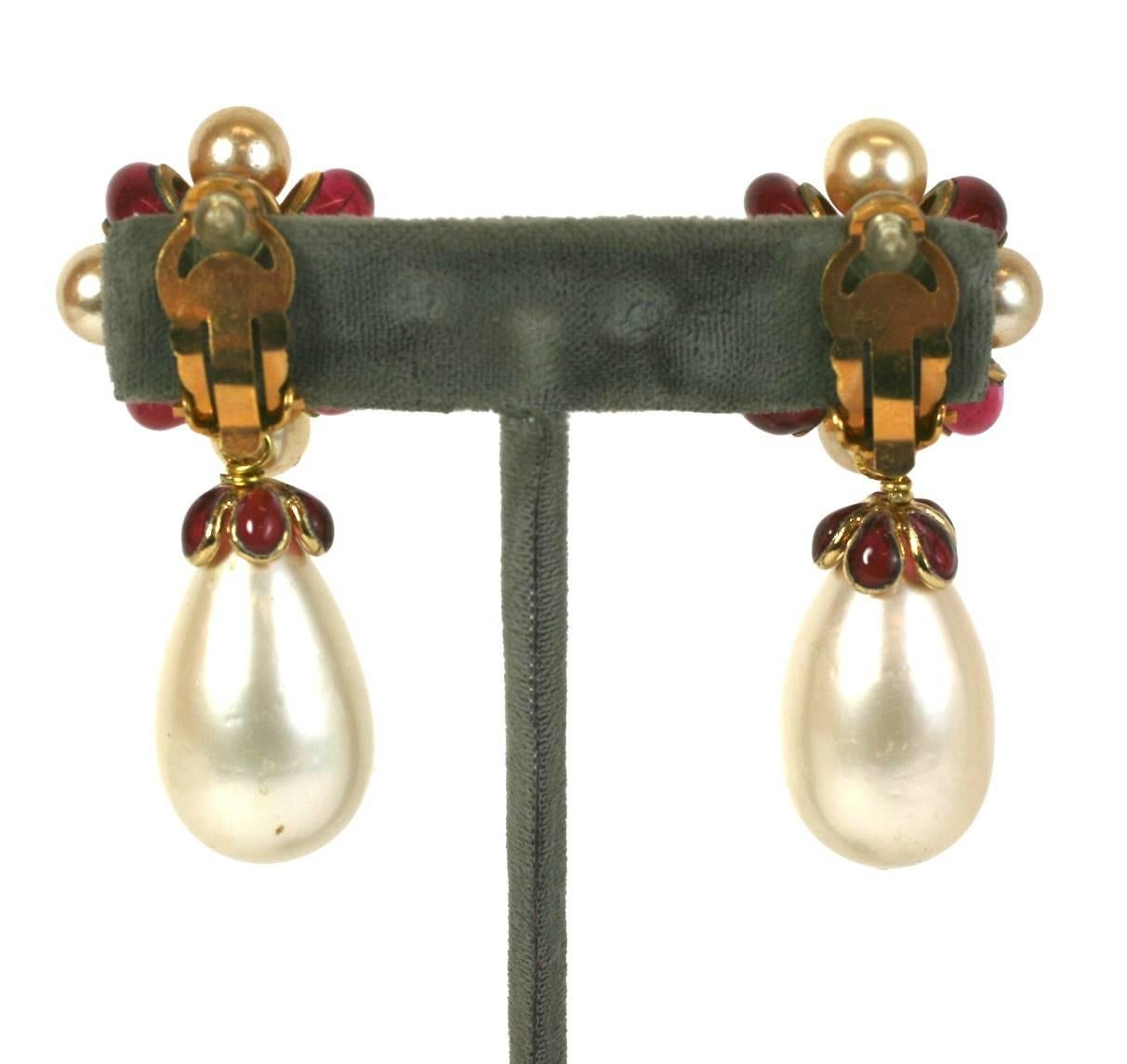 Chanel Ruby Pate de Verre Bow Earrings by Maison Gripoix. Beautiful Baroque configuration with large pear shaped pearls capped with ruby poured glass caps.  2.5