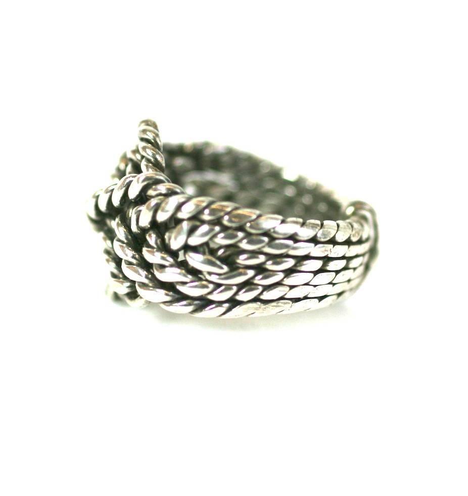 Elegant Handmade Sterling Puzzle Ring suitable for men or women. Handmade with heavy gauge twisted wire and designed to come apart into an attached puzzle formation (we were too scared to open it) which can be re-aligned into the ring as shown.