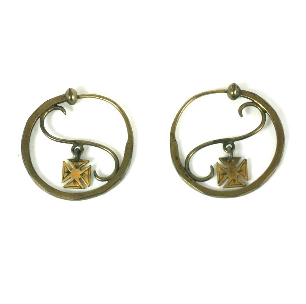 Early 19th Century French Hoop form earrings which close back to front. Handmade and designed with a Maltese cross pendant hanging in the center of each hoop.  Early 19th Century. 1.25