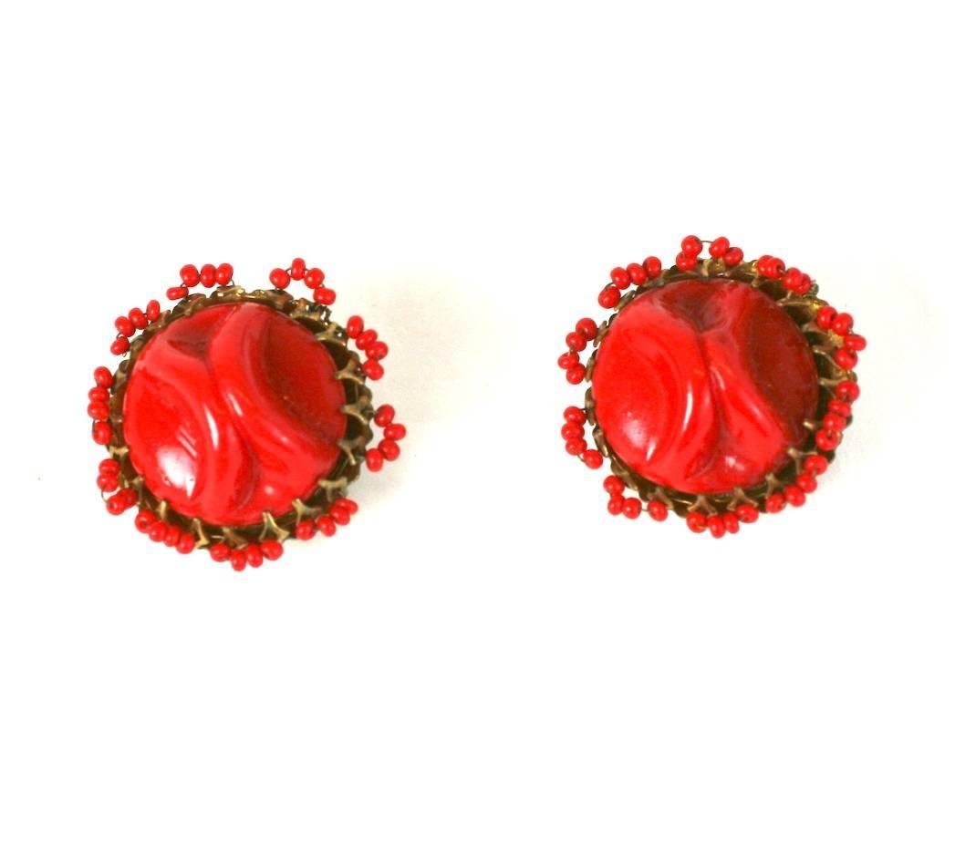 Miriam Haskell Hand made red pate de verre pinched cabochon ear clips set in Signature gilt filigree and further embellished with red seed bead edgings.
Clip back fittings. 1950's USA. Excellent Condition.
Diameter 1 1/8