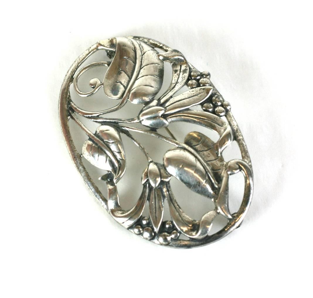 Heavy Danecraft cast sterling silver Floral Brooch, multi blossoms, leaves and berries are set within an oval framework resembling branches. Length 3