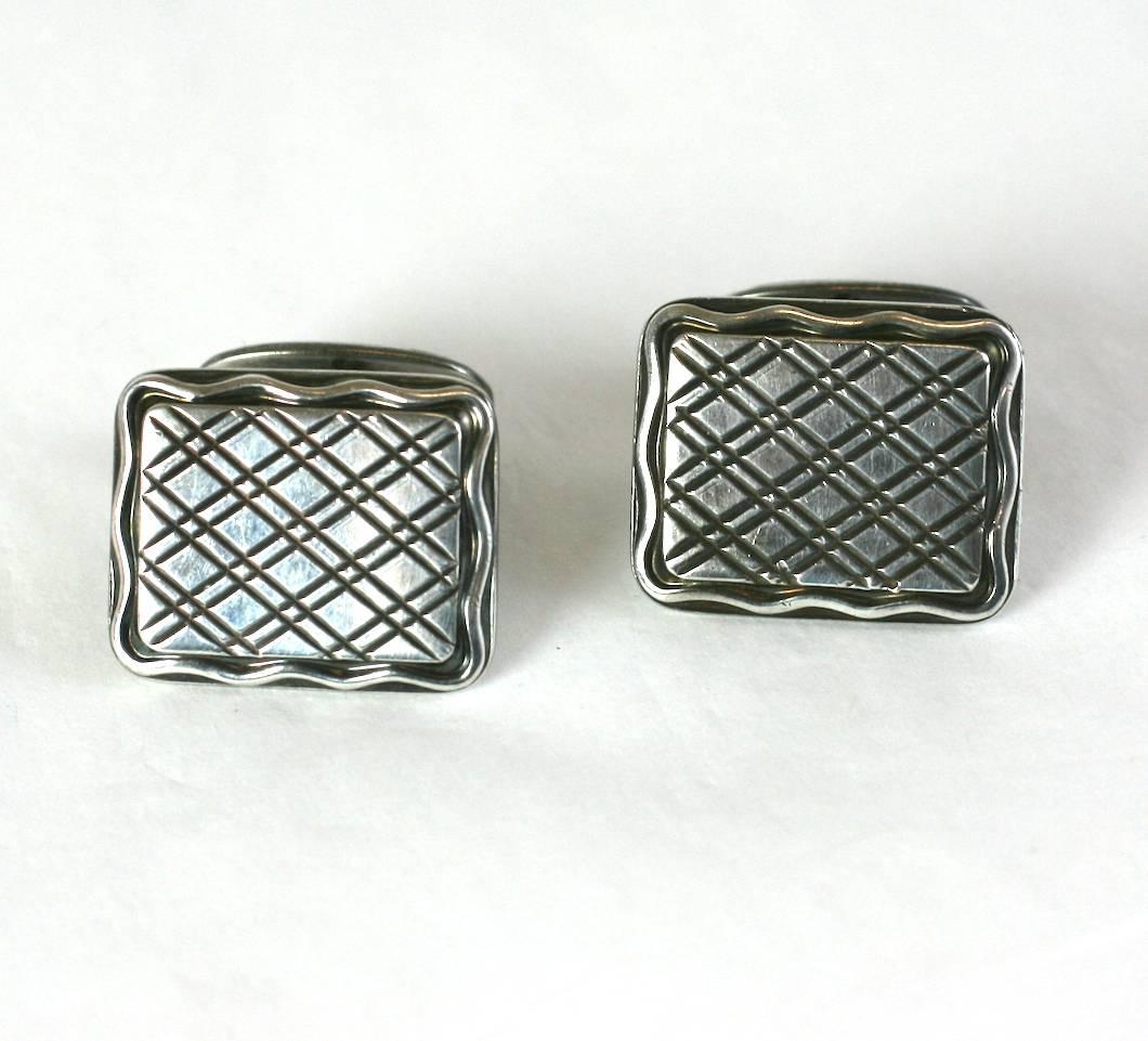 Attractive Design Silver cufflinks with crosshatched designs and wavy border, slightly French in flavor but German in origin. Toggle backs are decorated with similar design as well. Excellent condition. 
1940's Eu. Approx 7/8