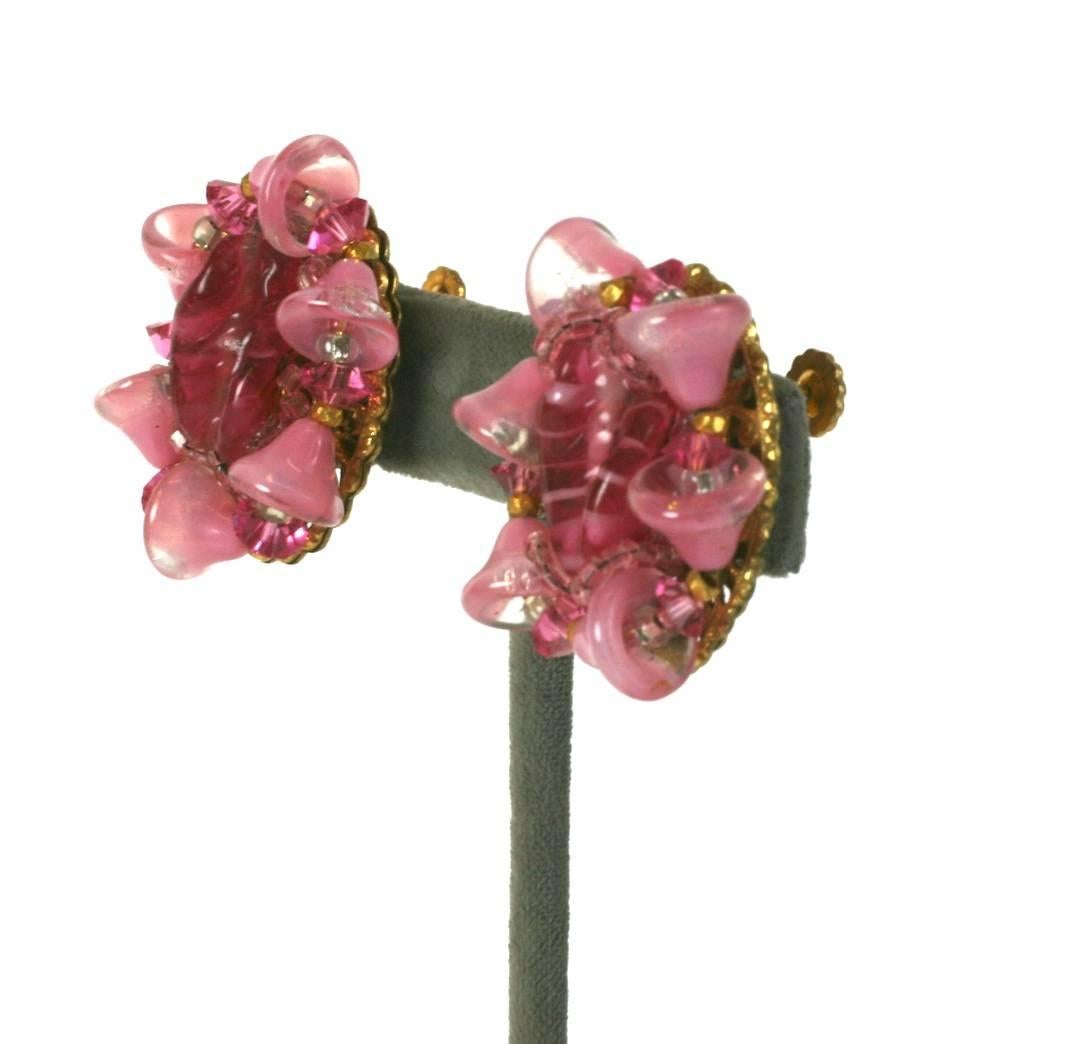 Miriam Haskell Pate de Verre ruby and faux pink quartz earclips. The ruby pinched glass handmade stones are surrounded with pink glass morning glories, small ruby glass and gold seed beads. Mounted on signature Russian filigree. Clip back fittings.