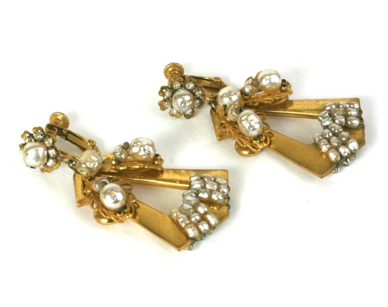 Miriam Haskell long Revivalist articulated earrings. Of Signature Russian Gilt, incorporating various sized faux baroque pearls and filigrees. Classic flower head motifs on ear clips. Clip back fittings. Excellent Condition. 1940's USA. Length 2.5