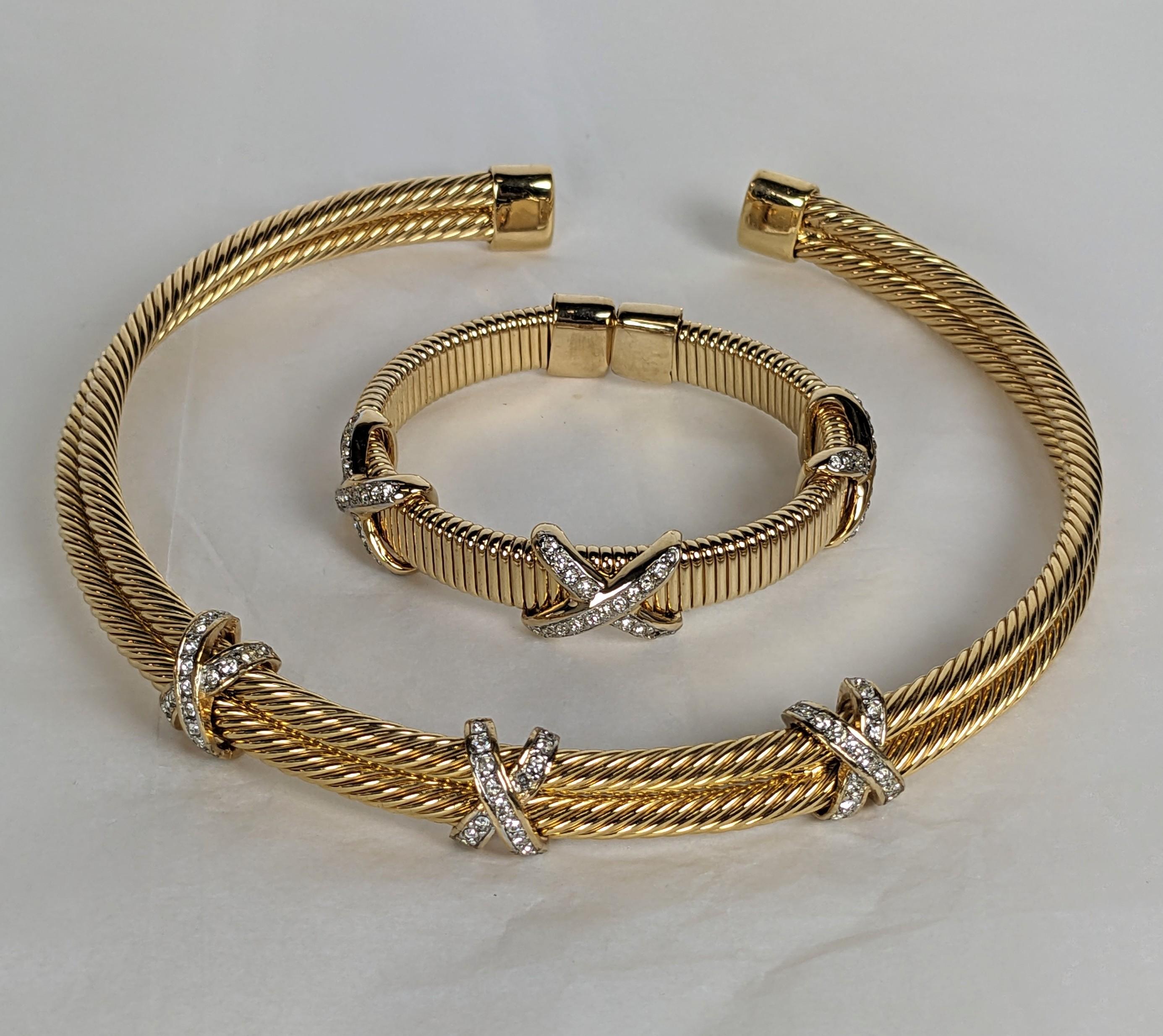 Elegant Pave X Gilt Collar and Cuff from the 1990's Italy. High quality faux jewelry in the Bulgari style. Hard collar and stretch bangle in ribbed gold finish with pave X motifs. 1990's Italy. 