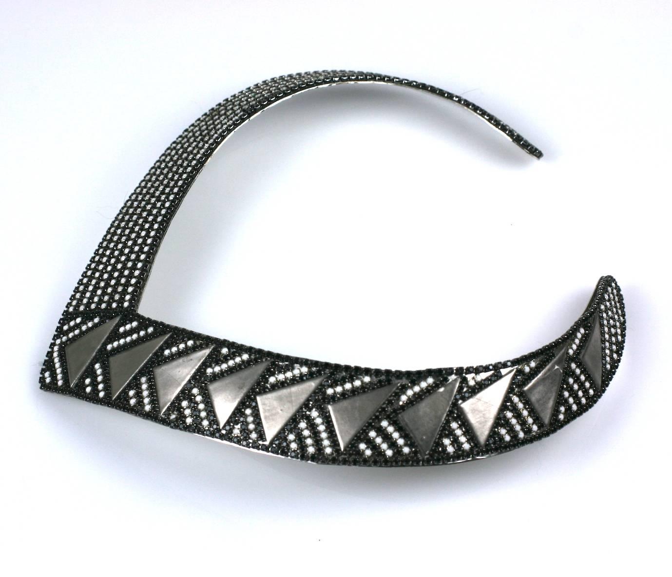Roxanne Assoulin Deco Style Collar from the 1980's is embellished with chalk and jet rhinestone strips manipulated with silvered metal triangles. Attractive and easy to wear. 1.2