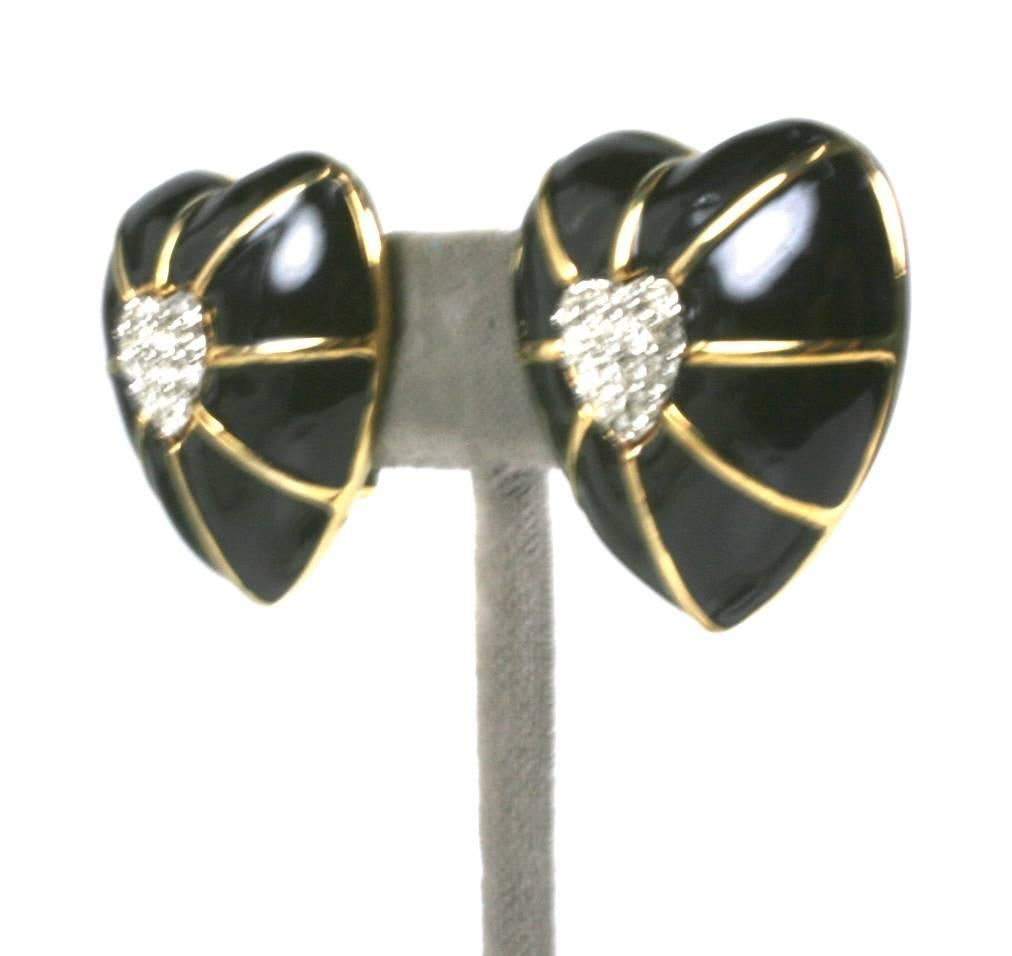 Jewelry by French Mod Couturier Andre Courreges is relatively scarce. Large black enamel puffy hearts are set with pave rhinestone centers. Clip back fittings. 1980's France. 1.25