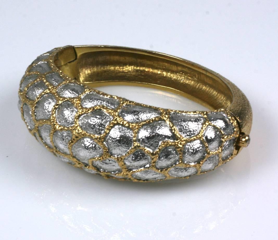 Jomaz Textured Bangle in Gold and Silver Gilt with an unusual animal skin motif. 1970's USA. Joseph Mazer made high quality costume jewels which often mimicked the fine jewelry of the period. 1