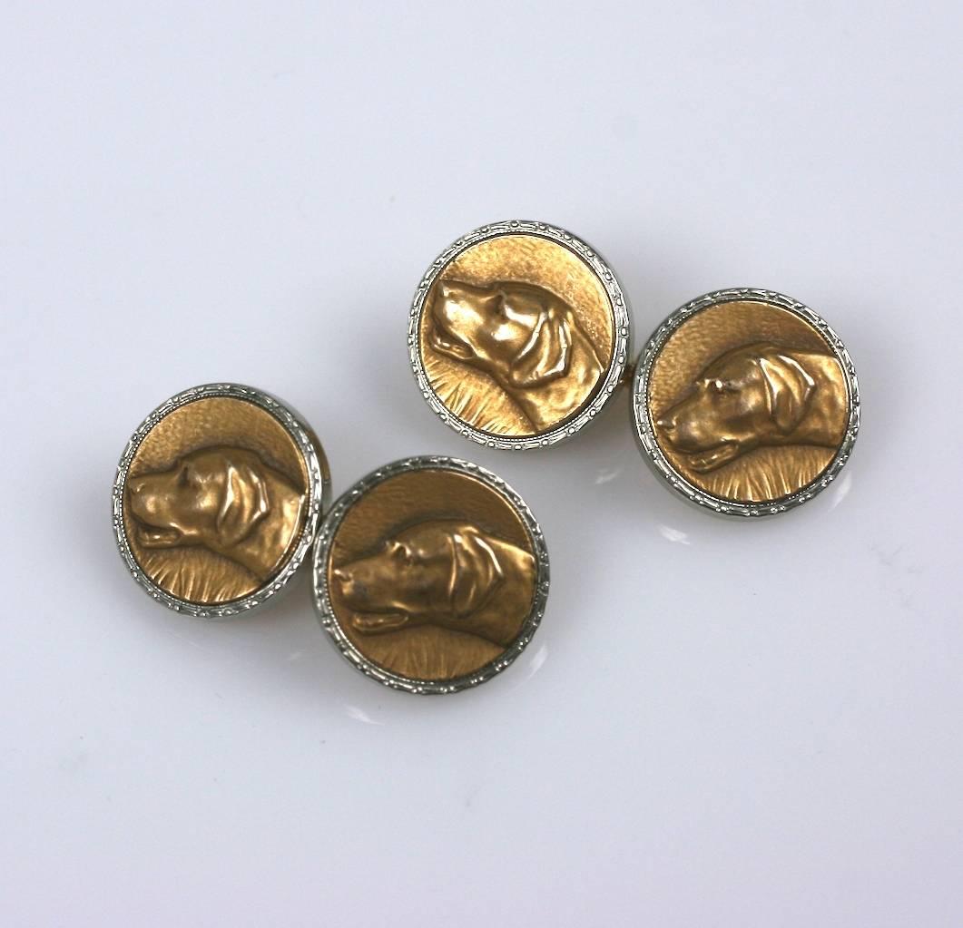 Art Deco cufflinks with hunting dog motifs by Krementz. Gilt relief dog heads are set on silver plated bases. Lovely original condition. 1930's USA. 
.5