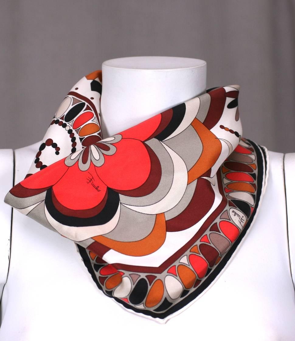 Emilio Pucci graphic diamond shaped scarf in silk twill in vibrant autumnal tones. Versatile shape can be worn in various configurations.  