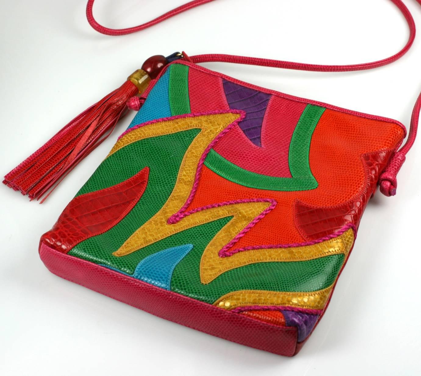Sharif Pieced Shoulder Bag in brilliant multicolored shades in snake and croc grained leathers with large tasseled zip charm. Hidden zip pocket on back. 1980's USA. Excellent condition.   8