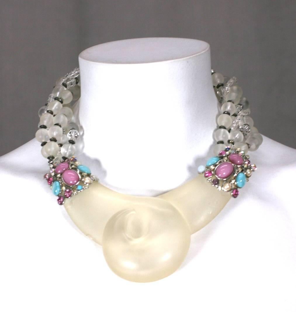 Unusual Lucite Necklace by Les Bernard from the 1980's. A large frosted lucite swirl forms the central motif. Twisted strands of clear and faceted lucite are mixed with black lucite beads in a torsade formation with pastel jeweled and faux pearl