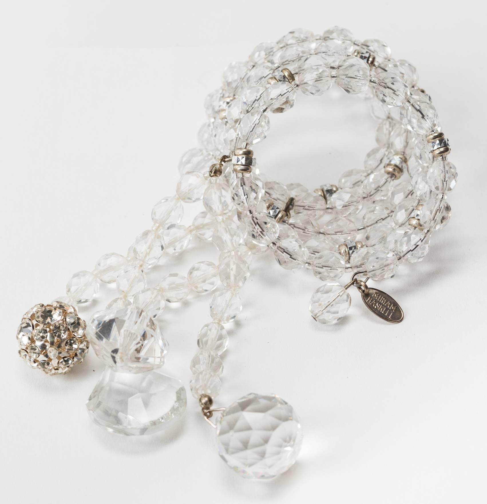 Miriam Haskell five row crystal wrap bracelet of faceted round crystal beads, and silver gilt  jewel cut rondelles with dramatic trendrils of chandelier glass crystals, lucite crystal prisms, and crystal paste set beads. Excellent condition.