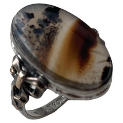 Antique Art Nouveau Sterling Silver and 10K Gold Ribbon Motif Agate Ring, c. 190