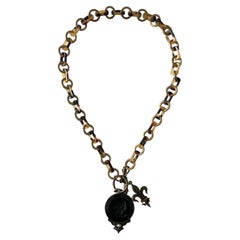 Extasia C.1990s Vintage Black Glass Cameo Fleur-de-Lis Toggle Pendant Necklace