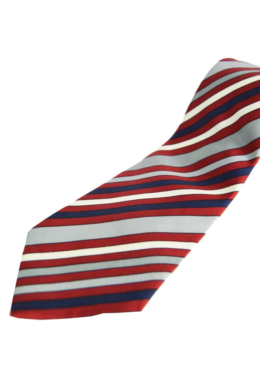 An elegant vintage mens necktie in a pure silk satin by French luxury fashion house, Givenchy. Such a classic red, white, blue & grey stripe, it would make the perfect gift for him. 

Total length - 57