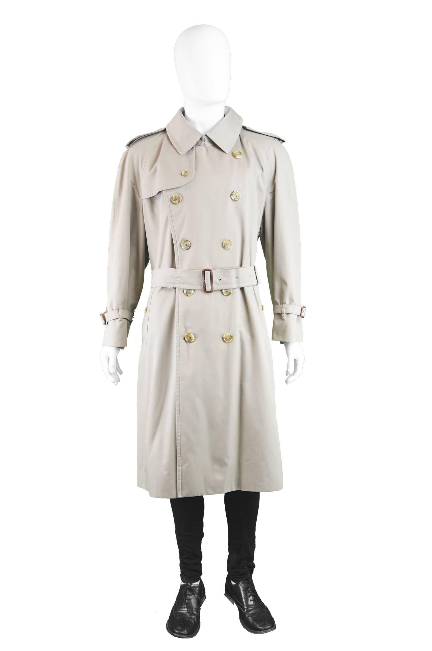 An excellent vintage men's trench coat / mackintosh by Burberry from c.1980s when, prior to dropping the 's' in 1998, they were known as Burberrys. Incredible quality, moreso than most other Burberry trenches we've had. With a long belt to pull in
