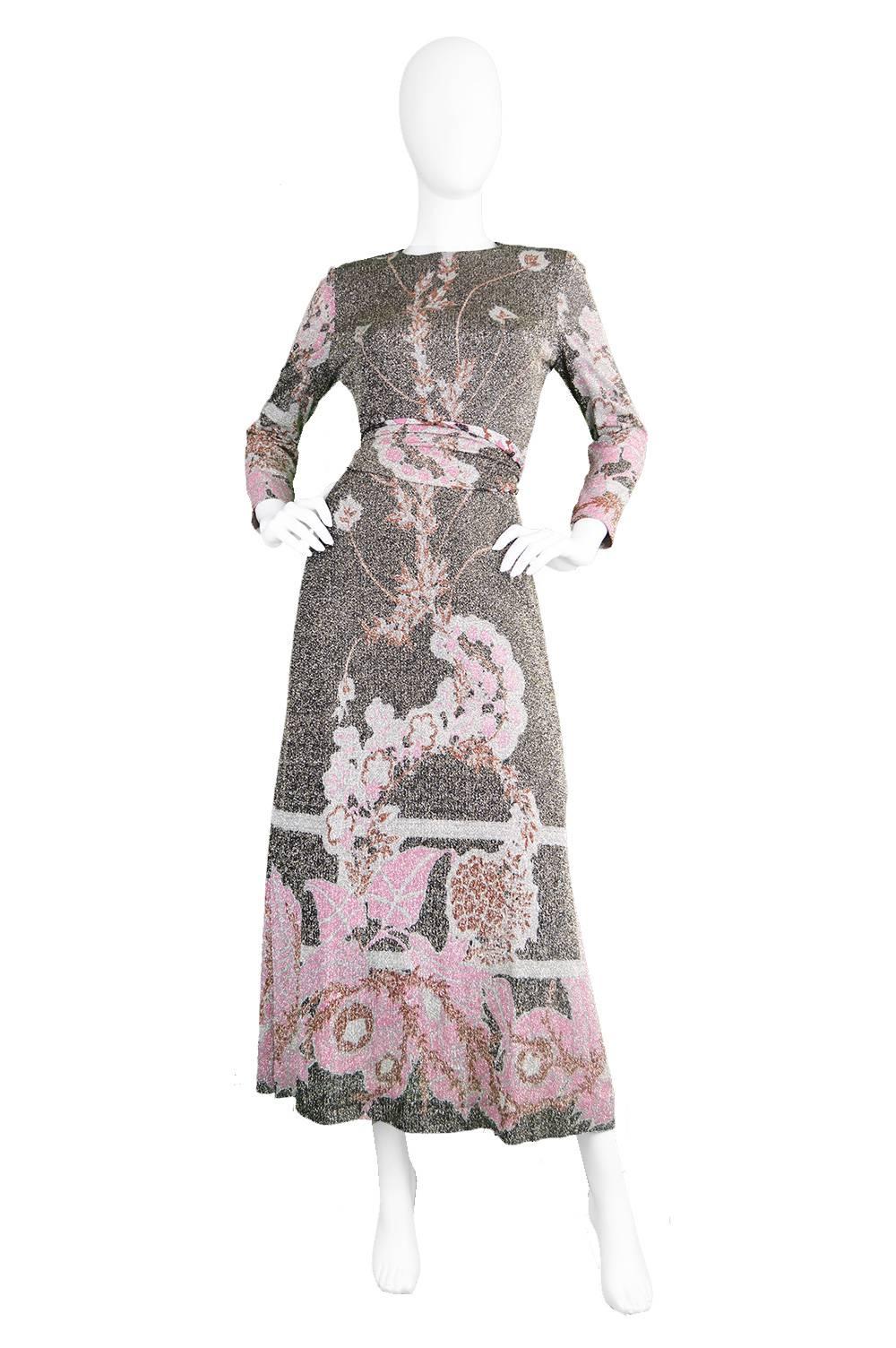 An incredibly elegant vintage maxi dress from the early 1970s by legendary French designer, Pierre Cardin for his high quality Jersey Couture line. In a slinky floral-printed jersey with gold lurex throughout, this glamorous dress is sure to be