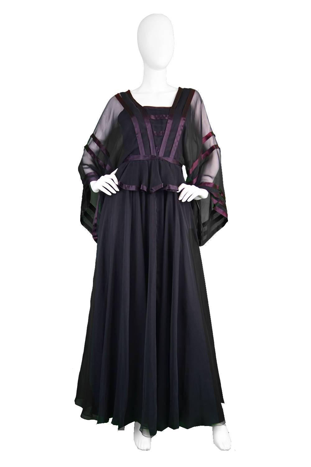 An incredible vintage evening gown from the 1970's by genius and increasingly collectible vintage British designer, Jean Varon (aka John Bates). With wide, almost kimono style sleeves in a black chiffon, with a satin trim which almost gives an