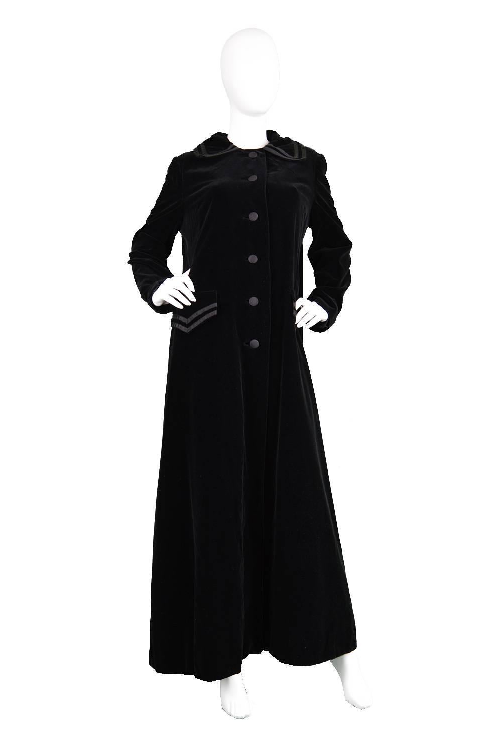 An incredible vintage maxi coat from the 1960s by iconic vintage designer Louis Féraud. This avant garde full length coat has some incredible fullness which falls towards the back and gives a swing silhouette. Is the perfect accompaniment to a