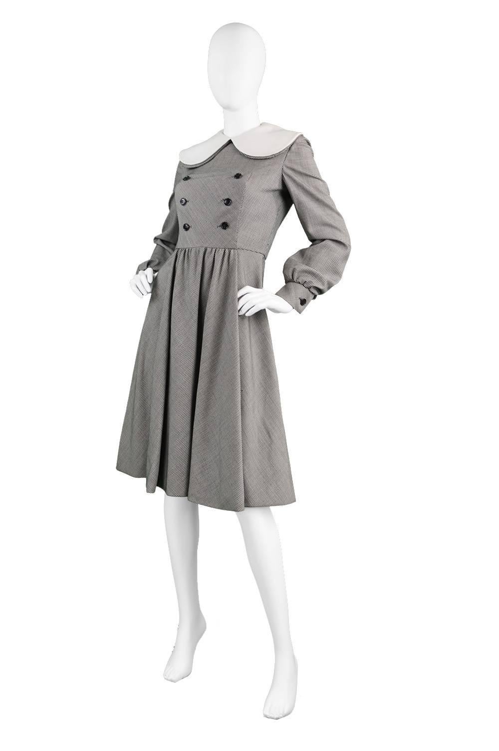 A chic and sophisticated vintage dress by iconic American designer, Geoffrey Beene from the 1970s. In a quality wool fabric with a micro houndstooth check and incredible drape and a white linen peter pan collar. Known for his simple and timeless