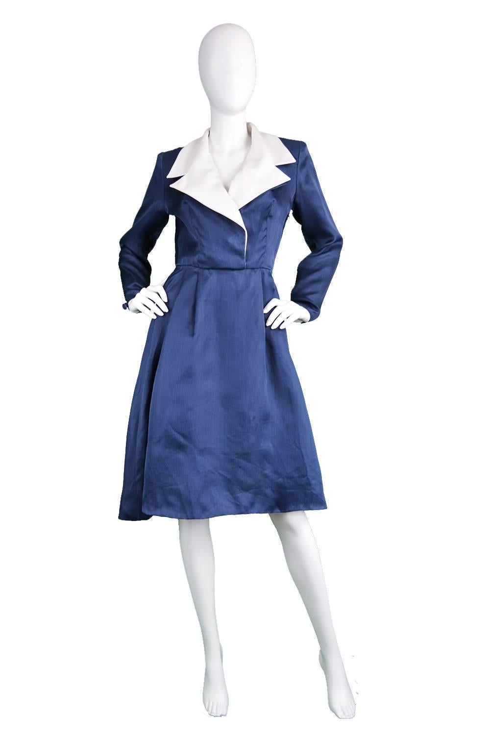 An incredibly chic and elegant vintage dress from the 1980s by legendary French fashion house Givenchy for their luxurious 'couture' line. In an unusual, blue organza fabric with a white linen collar. Made in France, this luxurious dress is light
