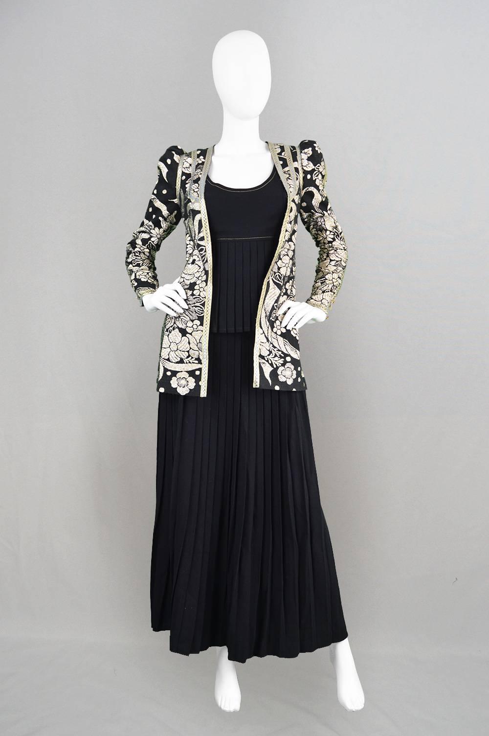 An incredibly elegant vintage three piece set from the 1970's by highly collectible and extraordinary British designer, Bill Gibb. In a luxurious wool crepe which gives the most amazing drape - both the long maxi skirt and top are pleated, which