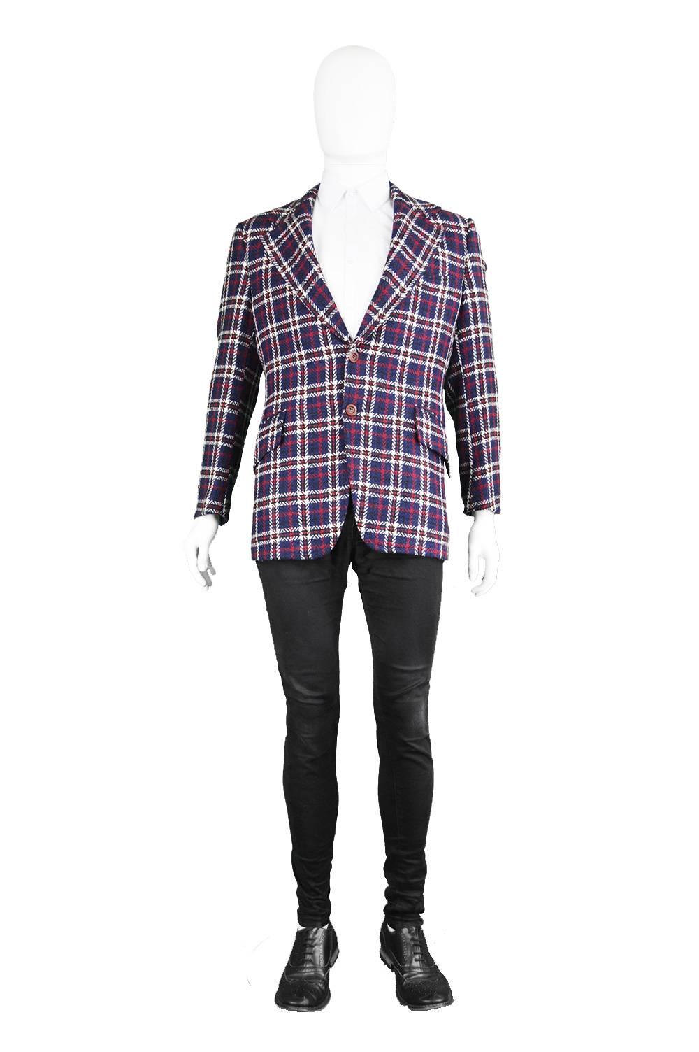 An incredible vintage men's checked wool blazer by Stix, Baer and Fuller, 1970s.  With wide, notched lapels and a vibrant check pattern on the front, this jacket is clearly influenced by the Carnaby Street styles of the time and adds a touch of