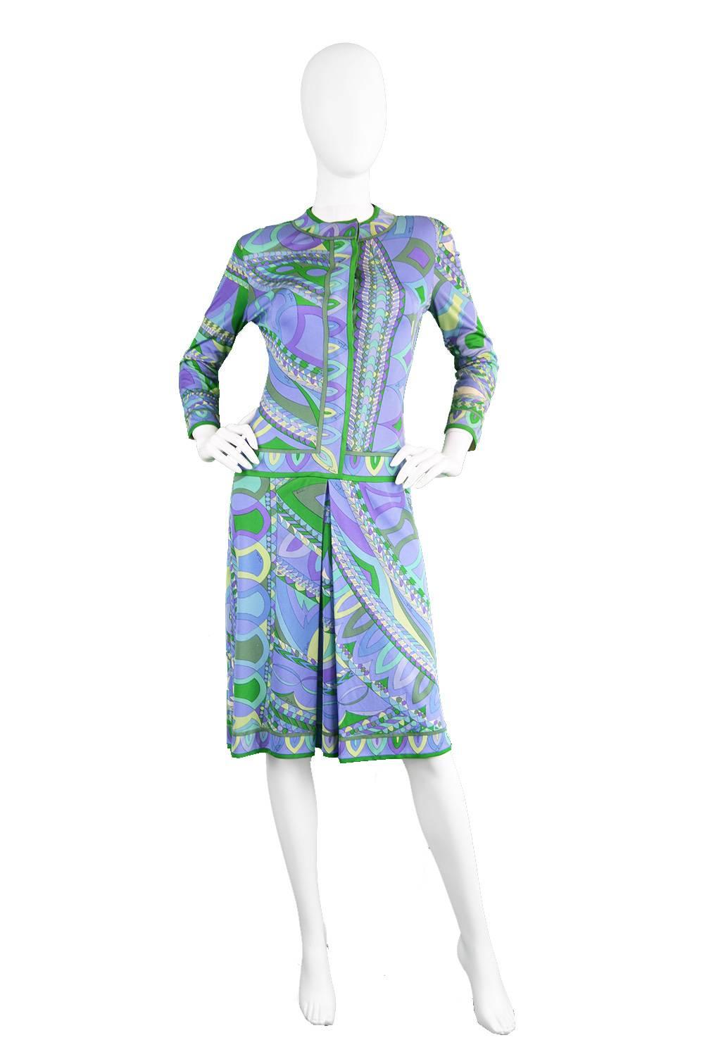 An incredible vintage Emilio Pucci shift dress from the 1960s in his trademark silk jersey, which gives incredible drape and fluidity and is signed with 'Emilio' throughout. In hues of purple, green and blue, this print is bold yet refined creating