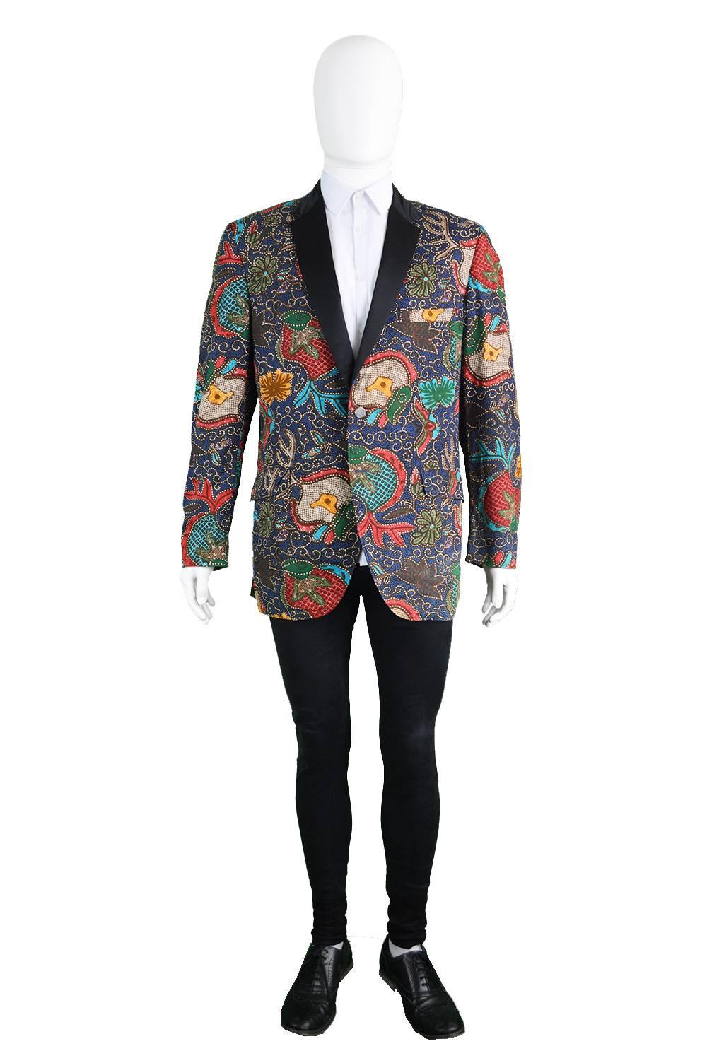 An incredible men's vintage blazer/ dinner jacket from the 1960s by luxury American department store, Neiman Marcus. Has amazing character, in a vibrantly coloured, African-inspired wax printed cotton and silk facing lapels this jacket is perfect