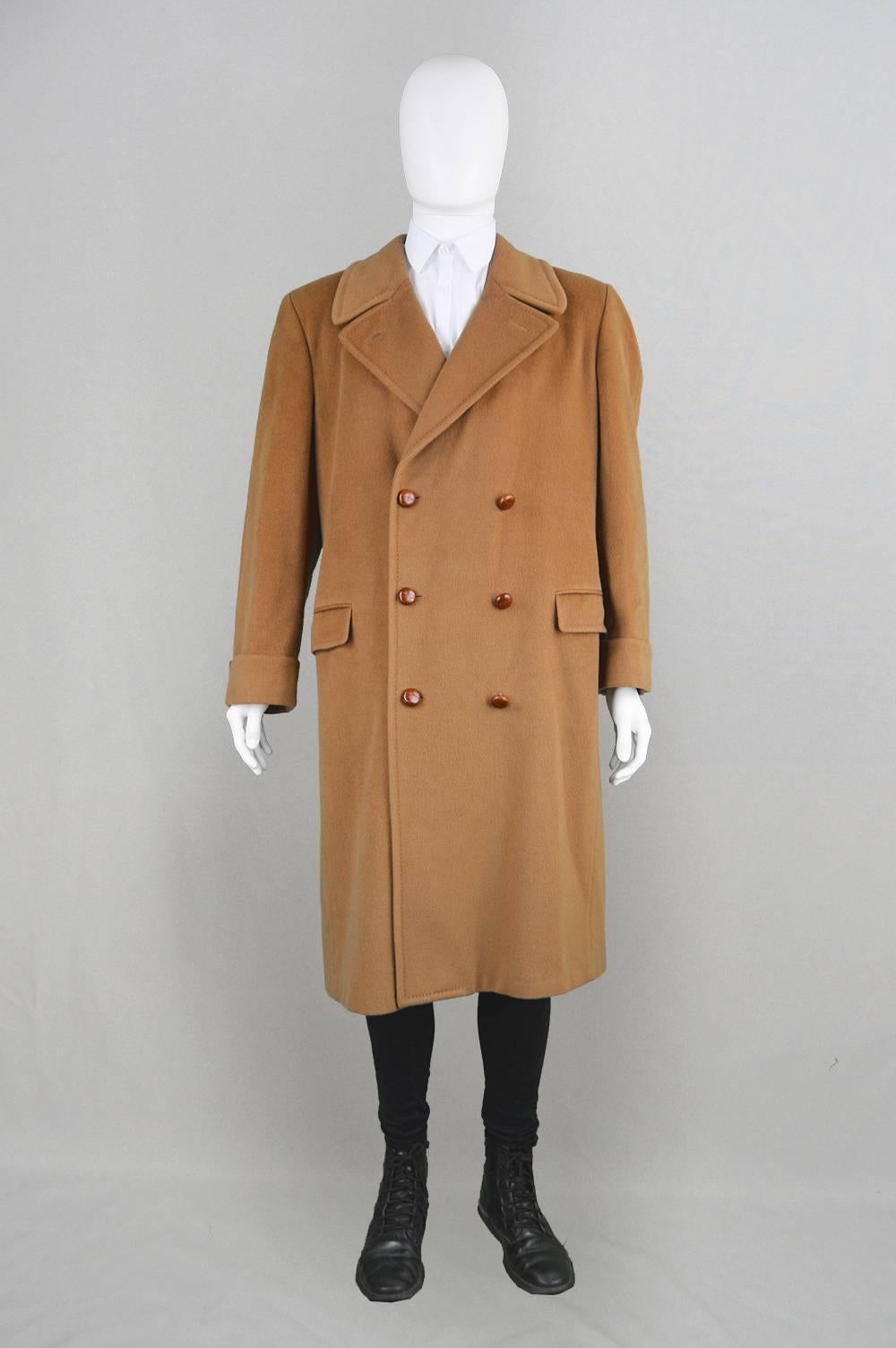 An incredible vintage men's peacoat/ over coat from the 1980s by renowned luxury Italian fashion designer, Valentino, for their men's line - Uomo. In a soft dark camel wool, which feels like its been blended with cashmere. Incredibly