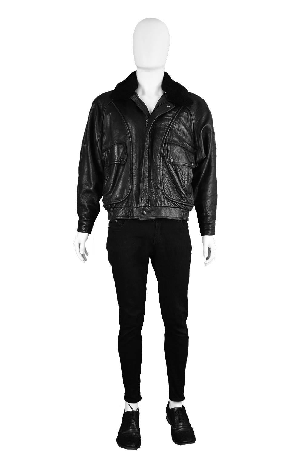 A buttery soft men's vintage leather coat / bomber jacket from 1988 with a detachable soft shearling collar and a bold atlas-inspired design on the lining. 

Estimated Size: Men's Medium to Large but this gives a slouchy, oversized fit. 
Chest -