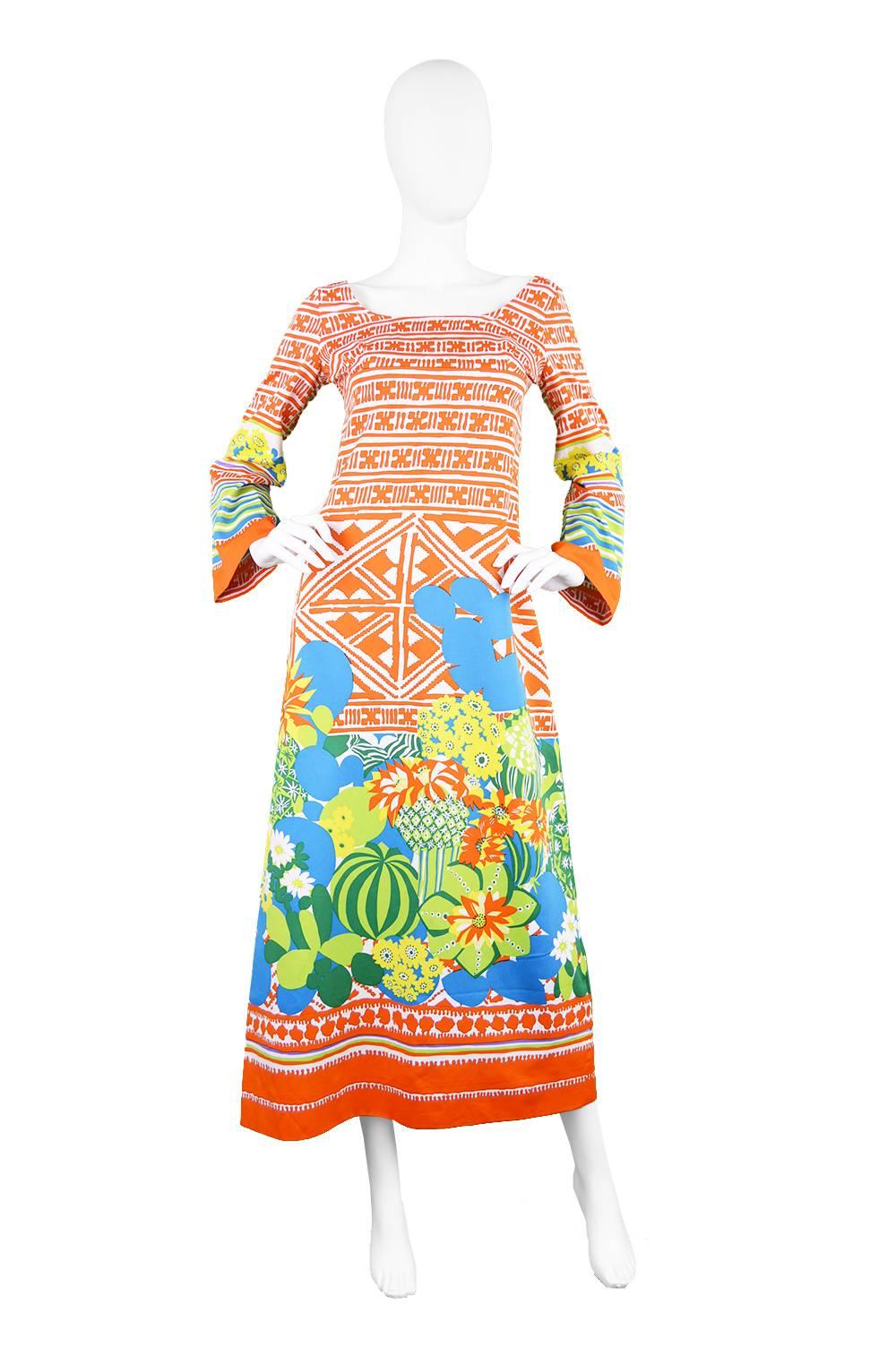 A vibrant and luxurious vintage Lanvin dress from the 1970s - the 1973 collection - a dress from the same collection was featured in the L'officiel magazine (please message for a link). With a cactus border print and an orange geometric print.