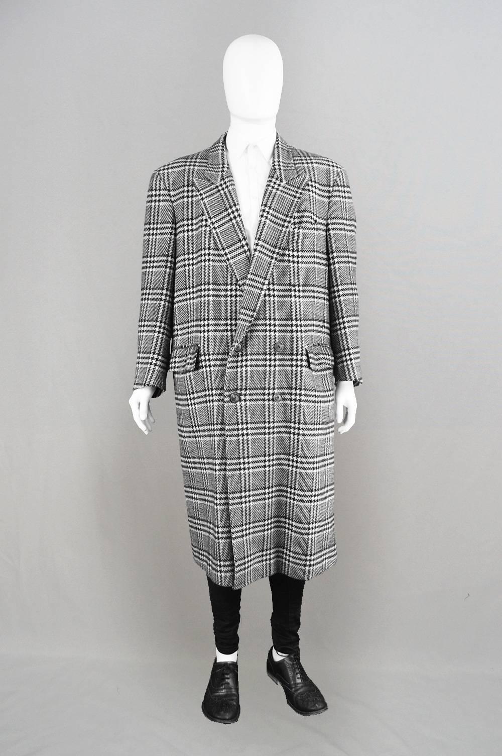 An incredibly stylish vintage men's overcoat from the 80s by luxury French label, Cacharel, for their rare men's line. With a wide, avant garde shoulder line, an edgy oversized fit and a black and white houndstooth, Prince of Wales check pattern