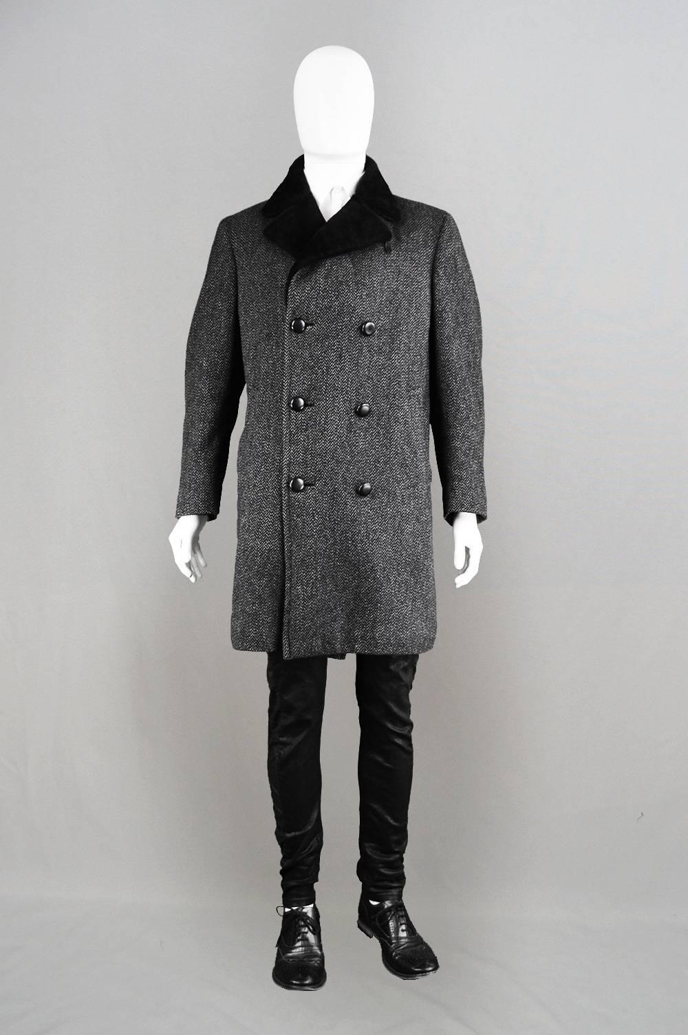An incredibly stylish vintage men's overcoat from the 1960's by British luxury label Aquascutum. With double breasted buttons and a timeless herringbone check pattern, this is a classic piece that is sure to be on-trend any year but with a faux fur
