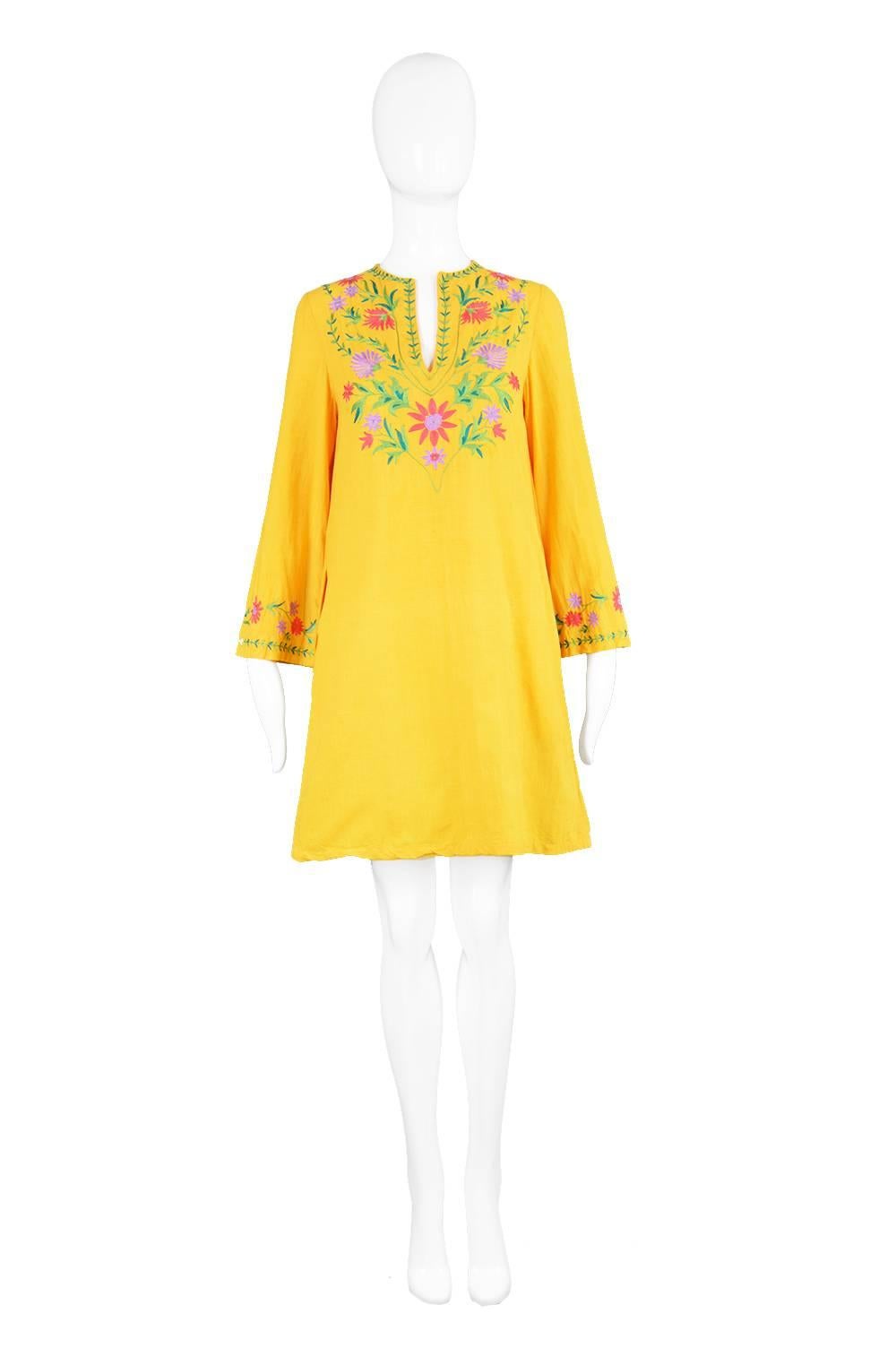 A vibrant and summery vintage dress from the 1970s by iconic and highly collectible British designer, Treacy Lowe. In a similar vein to Thea Porter and Gina Fratini, Treacy Lowe designed her luxurious, ethnic inspired clothes around her idea of a