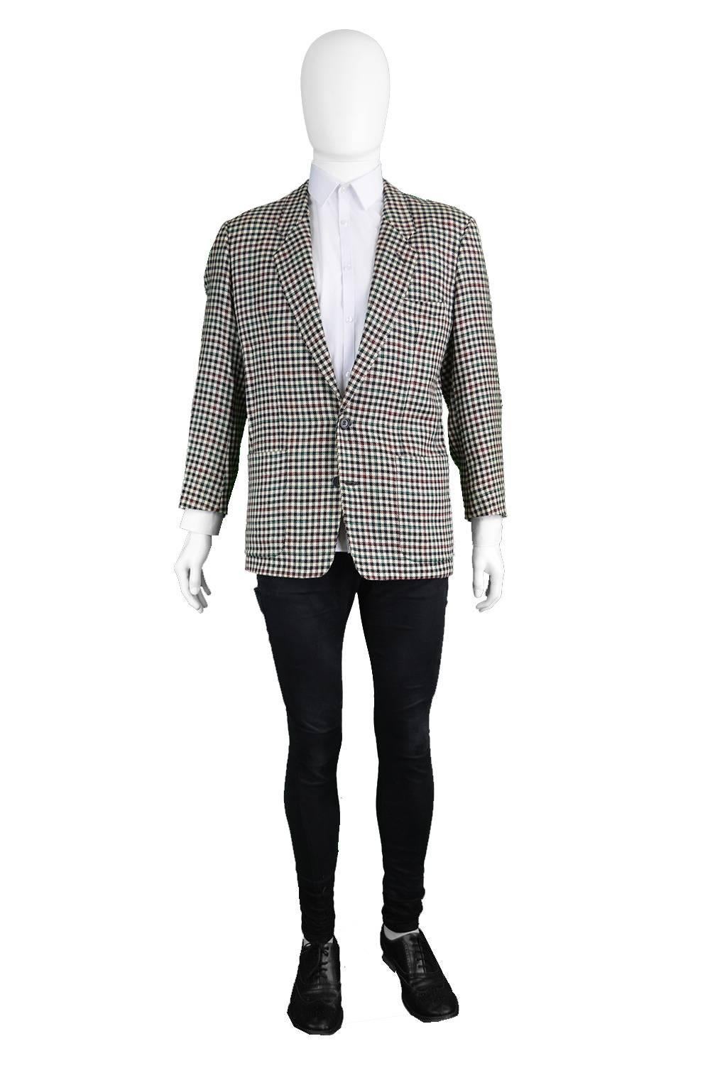 A vintage men's Kenzo Paris blazer from the late 80s/ early 90s in a pure wool black and white checked fabric, with green and red highlights throughout. Made in France, this quality jacket has two single breasted button fastenings and two patch
