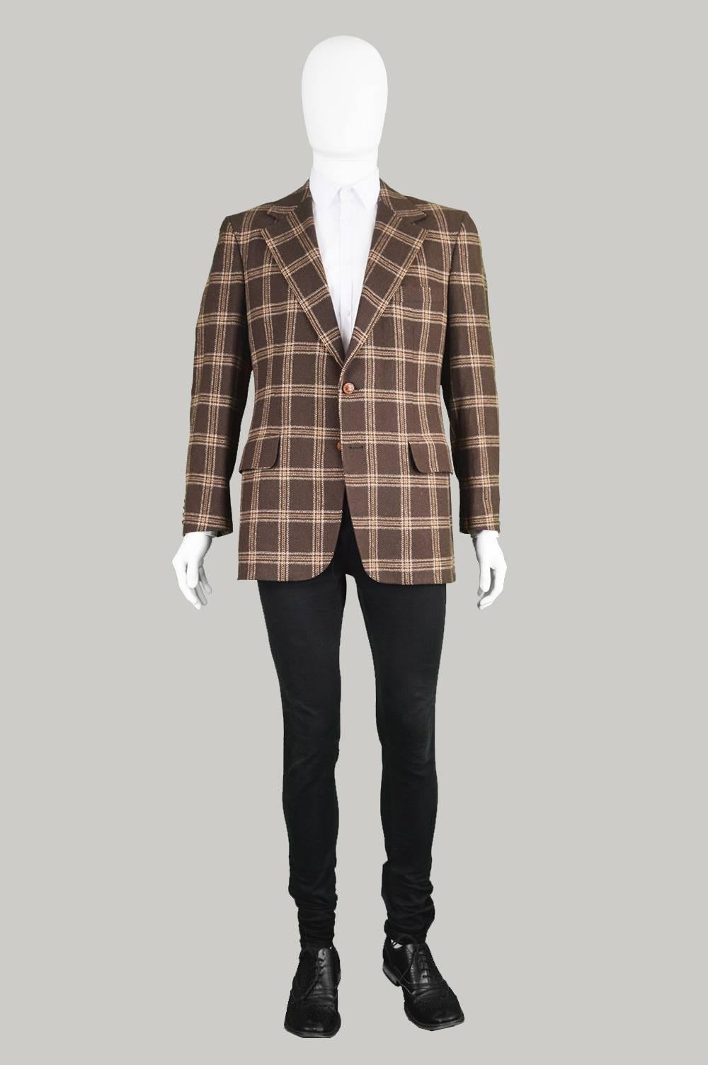 A sophisticated and superbly tailored vintage men's blazer/ sport coat by luxury French label, Lanvin. In a luxurious, brown camel hair fabric woven in Scotland with a classic checked/ plaid pattern throughout. The 70s flair and eccentricity of this