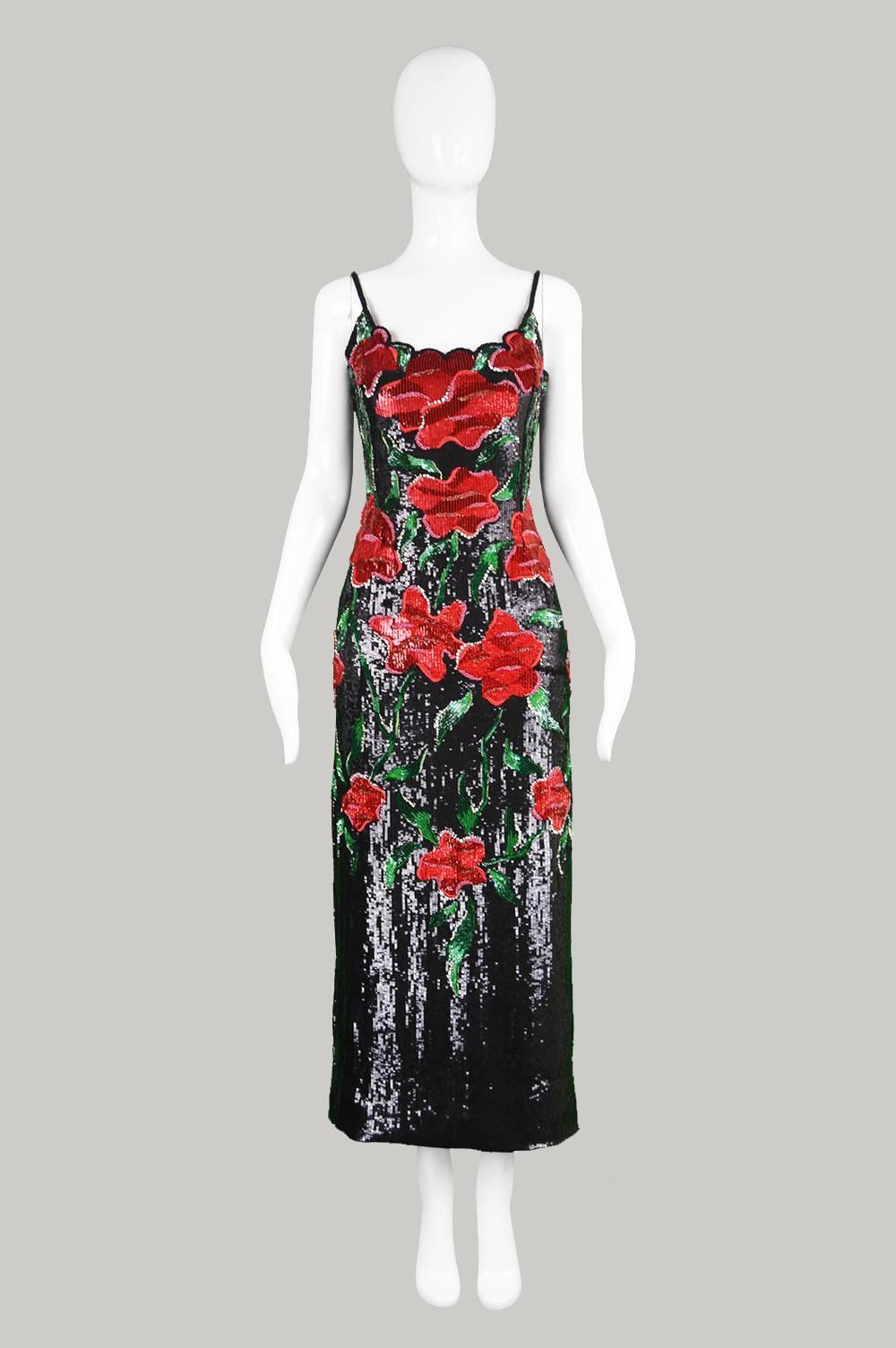 An exquisite couture vintage evening dress from c.the 1990’s by Italian designer, Renato Balestra. Incredibly glamorous, constructed in black, red and green sequins on a silk backing with hand embroidery throughout, creating a floral pattern. The