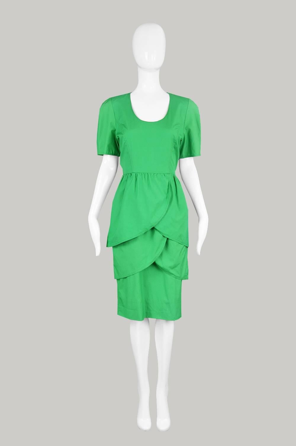 A chic vintage Guy Laroche dress from the 80s for the Paris boutique line, in a green cotton with a layered tulip skirt and a deep scoop neck. 

Estimated Size: UK 10-12/ US 6-8/ EU 38-40
Bust - 36” / 91cm
Waist - 28” / 71cm
Hips - 40” /