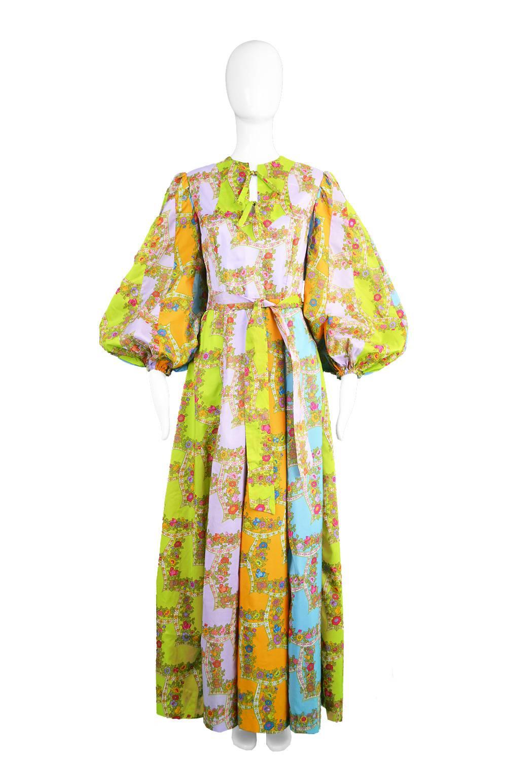 An absolutely breathtaking vintage Belinda Bellville maxi dress from the 1970s in a multicoloured, floral panelled fabric. 

Bust - 36” / 91cm
Waist - 28” / 71cm
Hips - Up to 46” / 117cm
Length (Shoulder to Hem) - 58” / 148cm
Shoulder to