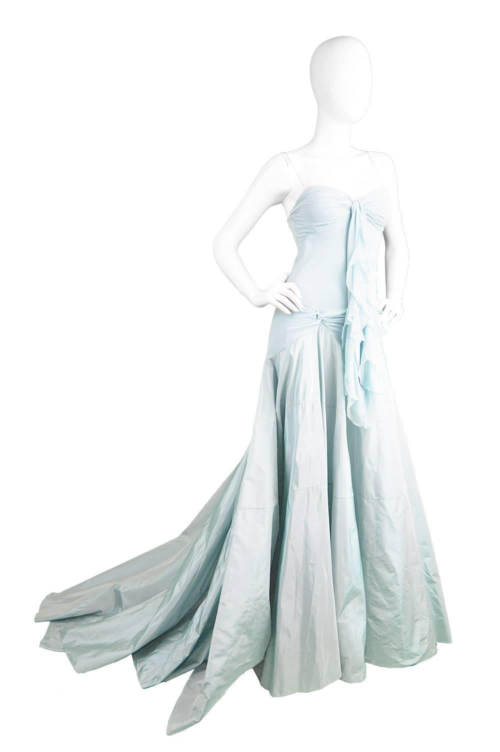 A showstopping evening gown by John Galliano for Christian Dior, c. 1990's in a bias cut silk chiffon with silk taffeta train.

Estimated Size: UK 6/ US 2/ EU 34
Bust - 31” / 79cm
Waist - 28” / 71cm
Hips - Up to 36” / 91cm
Length (Bust to Hem