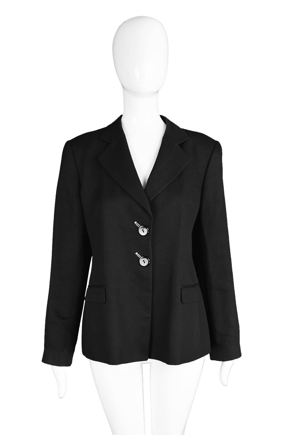 An immaculately tailored vintage Giorgio Armani women's blazer for the Emporio Armani line. Made in Italy, with a simple, minimalist look - the buttonholes are white and slanted diagonally for a unique touch. The fabric is a light, luxurious